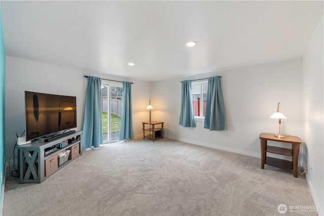 unfurnished living room with carpet, baseboards, and recessed lighting