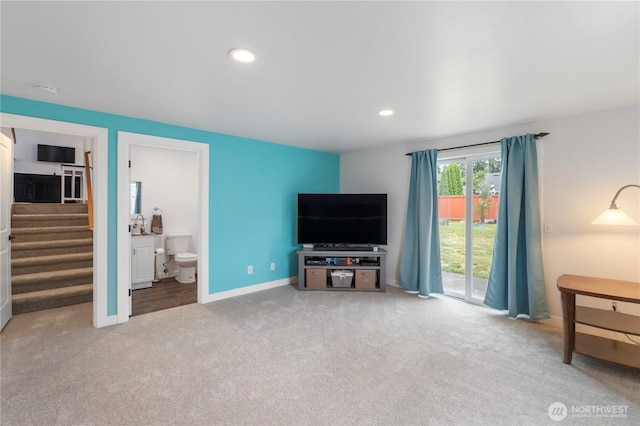 carpeted living room featuring stairway, baseboards, and recessed lighting