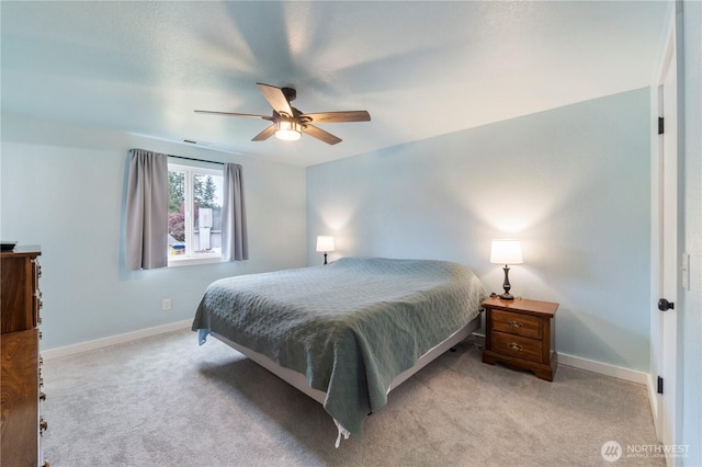 bedroom featuring carpet, baseboards, and a ceiling fan