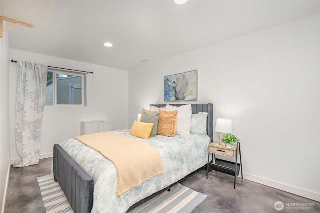 bedroom with recessed lighting, finished concrete flooring, and baseboards