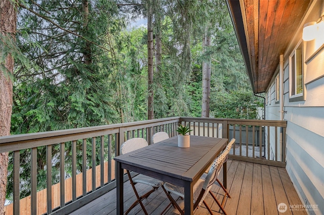 wooden deck with outdoor dining area