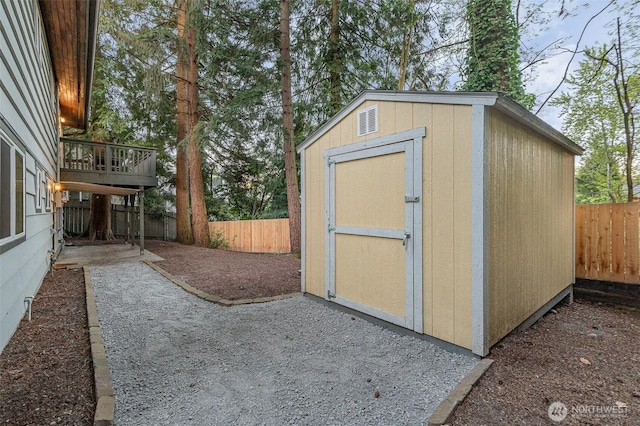 view of shed featuring a fenced backyard