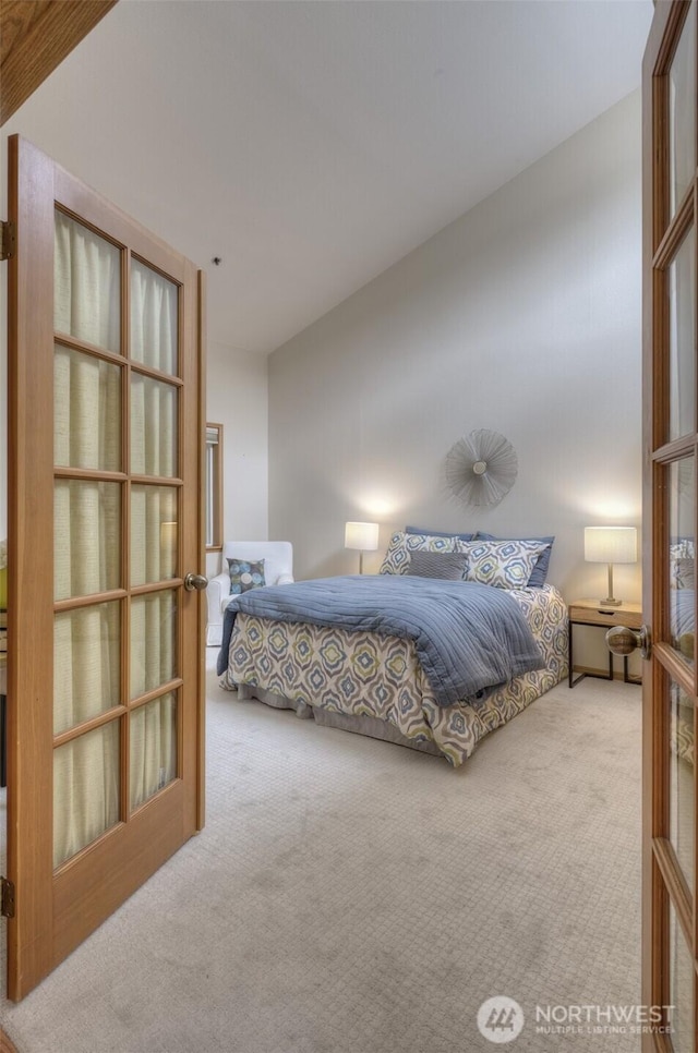 909 N 35th St Unit 402, Seattle, WA 98103 - bedroom with carpet floors and french doors