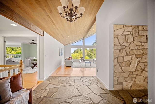 interior space featuring wood finished floors, a wealth of natural light, a chandelier, and wood ceiling
