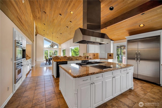 kitchen featuring wooden ceiling, plenty of natural light, appliances with stainless steel finishes, island exhaust hood, and a peninsula