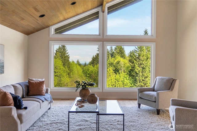 living area featuring wooden ceiling, wood finished floors, lofted ceiling, and visible vents