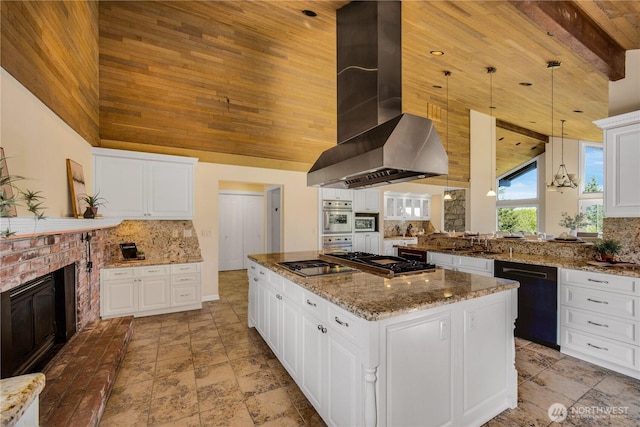 kitchen with high vaulted ceiling, black appliances, backsplash, and wall chimney range hood