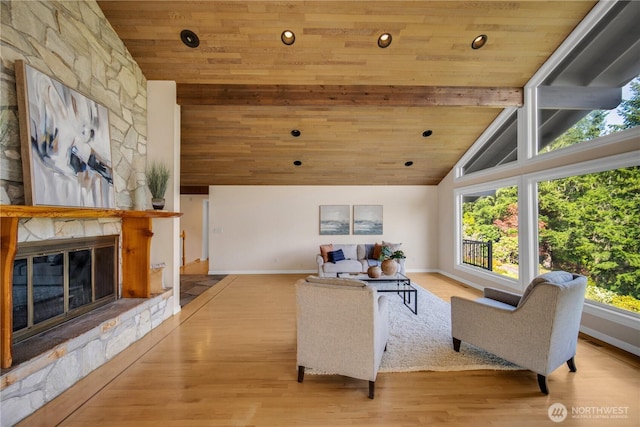 living area featuring wood ceiling, wood finished floors, vaulted ceiling with beams, and baseboards