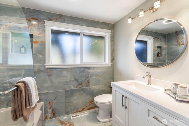 bathroom with toilet and vanity