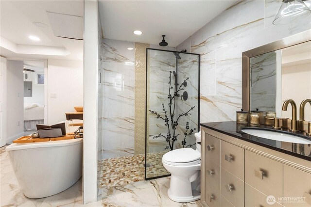 full bath featuring toilet, marble tiled floors, vanity, a marble finish shower, and electric panel