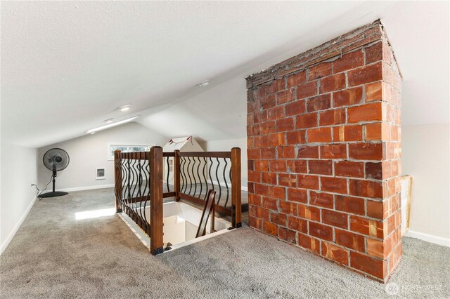 bonus room featuring vaulted ceiling, carpet, and baseboards
