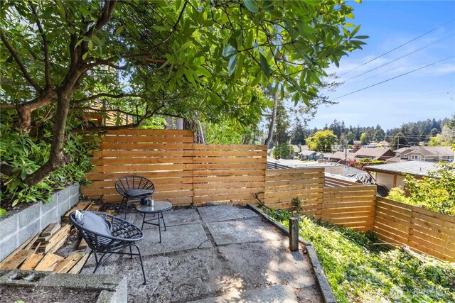 view of patio featuring fence