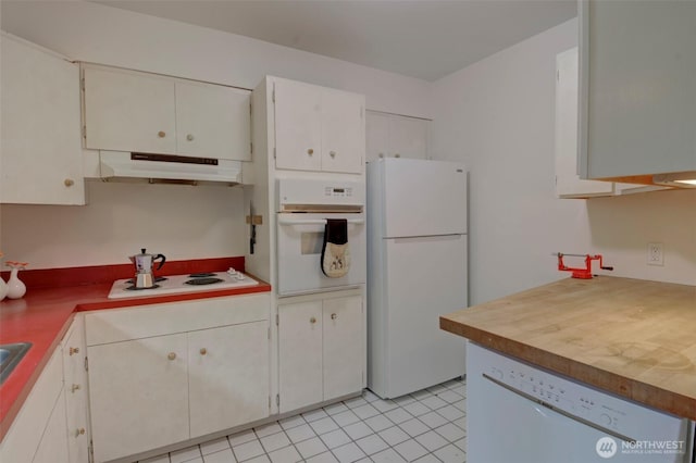 381 Fir Acres Dr NW, Bainbridge Island, WA 98110 - kitchen with light countertops, white cabinets, under cabinet range hood, and white appliances