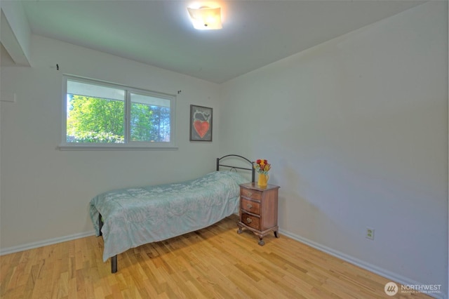 381 Fir Acres Dr NW, Bainbridge Island, WA 98110 - bedroom with baseboards and wood finished floors