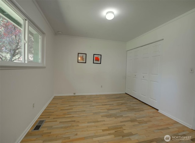 381 Fir Acres Dr NW, Bainbridge Island, WA 98110 - spare room featuring baseboards, visible vents, ornamental molding, and light wood finished floors