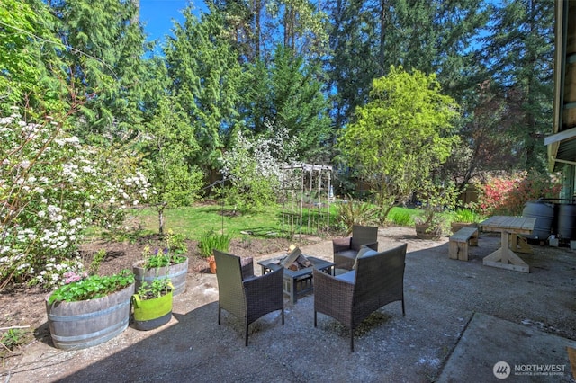 381 Fir Acres Dr NW, Bainbridge Island, WA 98110 - view of patio featuring an outdoor fire pit