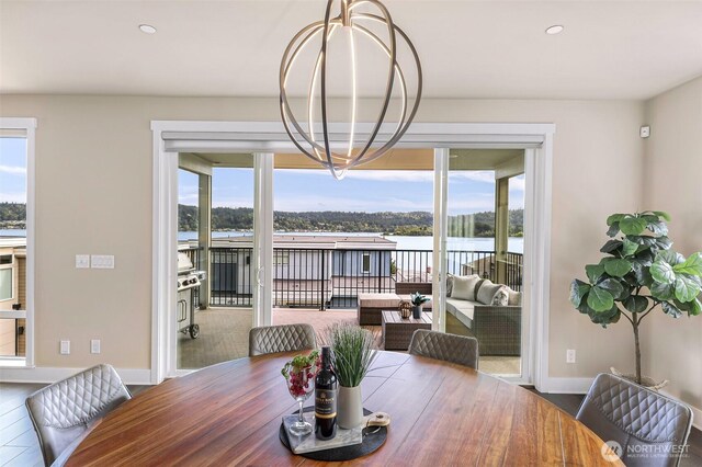 4888 194th Ave SE, Issaquah, WA 98027 - dining area featuring a healthy amount of sunlight, baseboards, and a water view