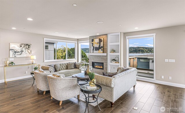 4888 194th Ave SE, Issaquah, WA 98027 - living room featuring a tile fireplace, baseboards, a wealth of natural light, and dark wood-style flooring