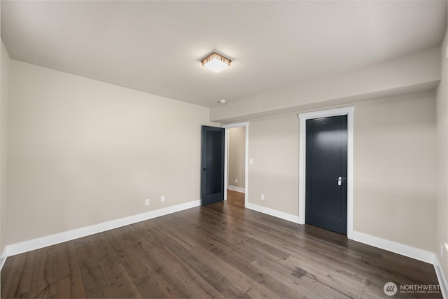 4888 194th Ave SE, Issaquah, WA 98027 - unfurnished bedroom with baseboards and dark wood-style flooring