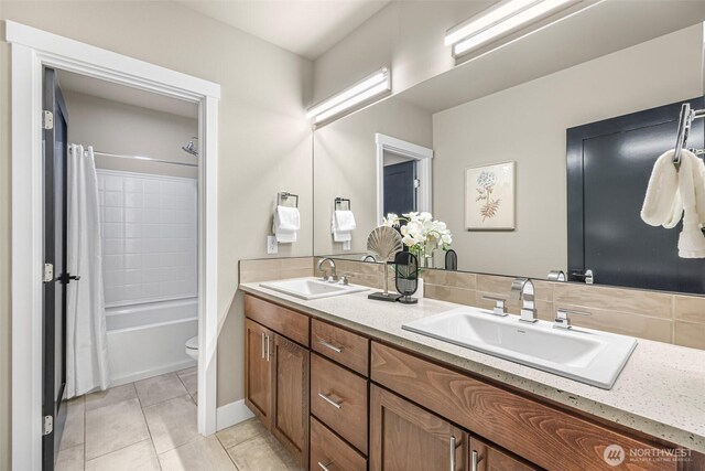 4888 194th Ave SE, Issaquah, WA 98027 - bathroom featuring tile patterned flooring, a sink, double vanity, and shower / bathtub combination with curtain