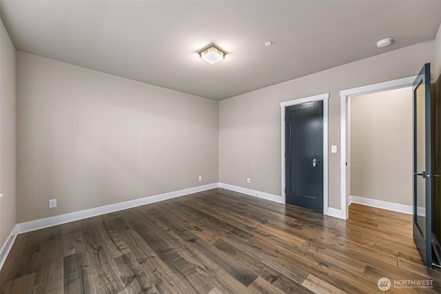 4888 194th Ave SE, Issaquah, WA 98027 - unfurnished bedroom with baseboards and dark wood finished floors