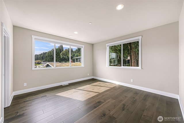4888 194th Ave SE, Issaquah, WA 98027 - empty room with plenty of natural light, baseboards, recessed lighting, and dark wood-type flooring