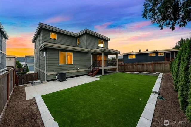 4888 194th Ave SE, Issaquah, WA 98027 - rear view of house featuring a lawn, a patio area, a fenced backyard, and cooling unit