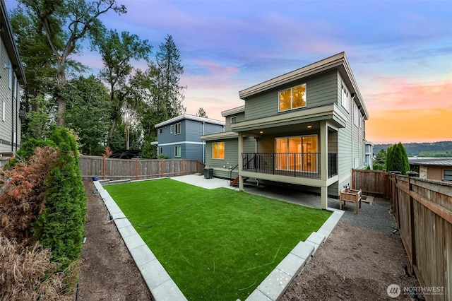 4888 194th Ave SE, Issaquah, WA 98027 - back of property featuring a lawn, a fenced backyard, and a patio