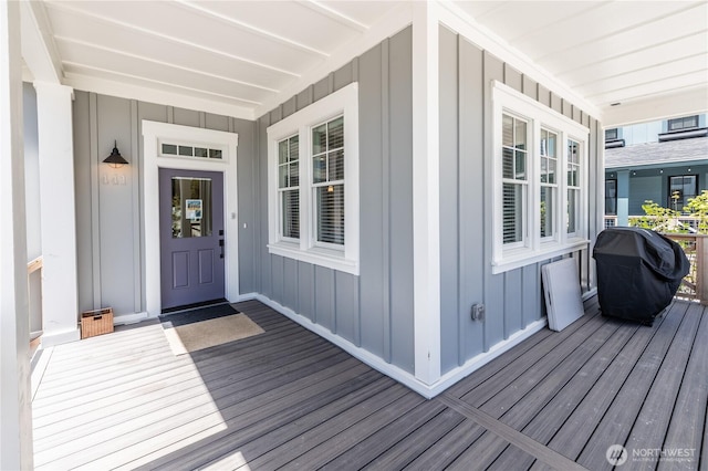 wooden terrace featuring covered porch