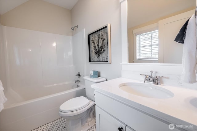 bathroom featuring bathing tub / shower combination, tile patterned floors, vanity, and toilet
