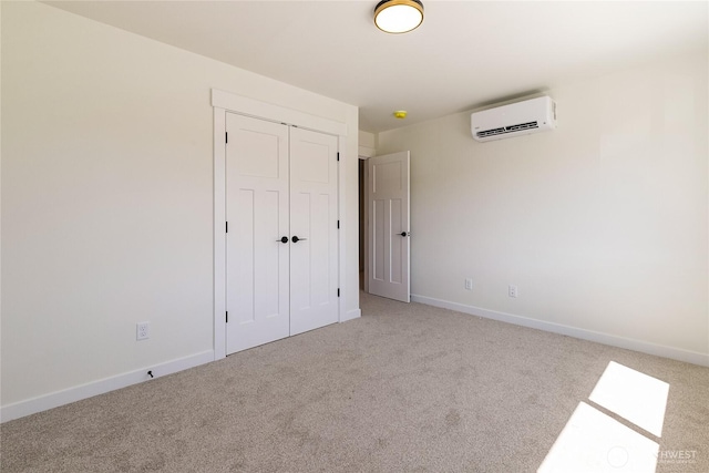 4226 Melrose Ln, Bellingham, WA 98226 - unfurnished bedroom featuring a wall mounted AC, carpet flooring, a closet, and baseboards