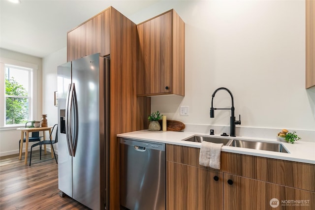4226 Melrose Ln, Bellingham, WA 98226 - kitchen with appliances with stainless steel finishes, light countertops, brown cabinets, and dark wood finished floors