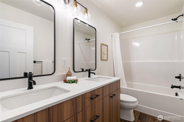 4226 Melrose Ln, Bellingham, WA 98226 - bathroom featuring shower / bath combination with curtain, double vanity, and wood finished floors