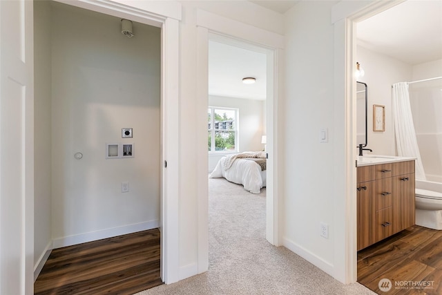 4226 Melrose Ln, Bellingham, WA 98226 - corridor with dark wood-style floors and dark carpet