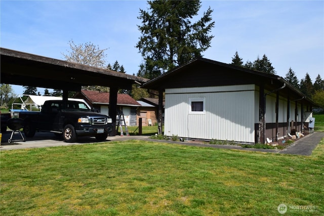 5317 208th St E, Spanaway, WA 98387 - view of side of home featuring a yard and a carport