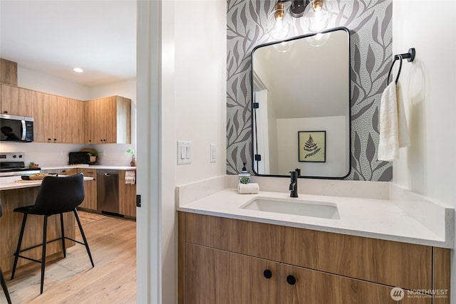 4228 Melrose Ln, Bellingham, WA 98226 - bathroom featuring wood finished floors, vanity, and recessed lighting