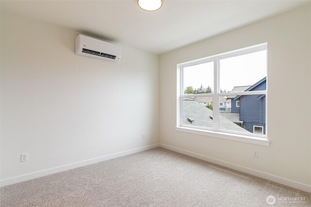 4228 Melrose Ln, Bellingham, WA 98226 - spare room with an AC wall unit and carpet