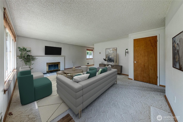 carpeted living area featuring baseboards, a brick fireplace, and a textured ceiling