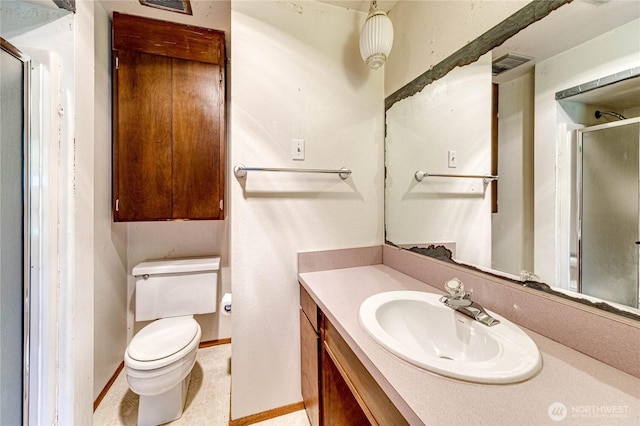 full bathroom with vanity, toilet, baseboards, a shower stall, and visible vents
