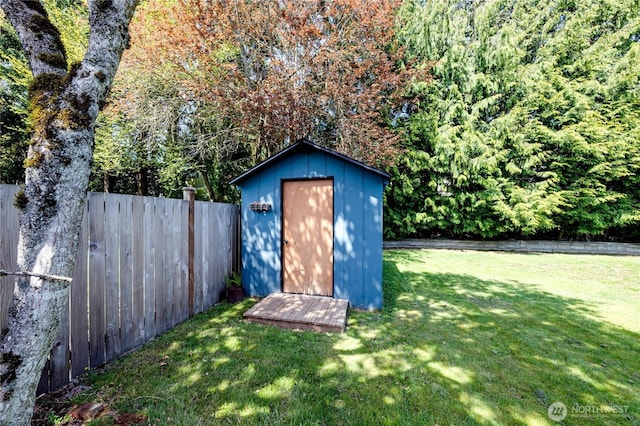 view of shed with fence