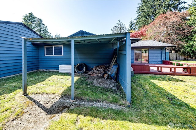 exterior space with a wooden deck and a yard