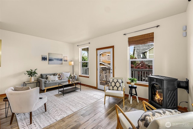 living room featuring wood finished floors and baseboards