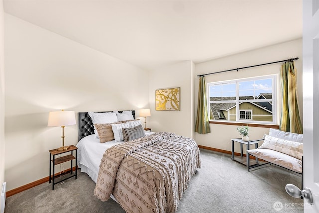 bedroom featuring carpet flooring, baseboards, and baseboard heating