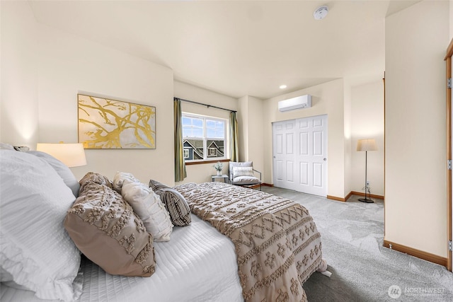 bedroom with carpet, a wall mounted air conditioner, baseboards, and a closet