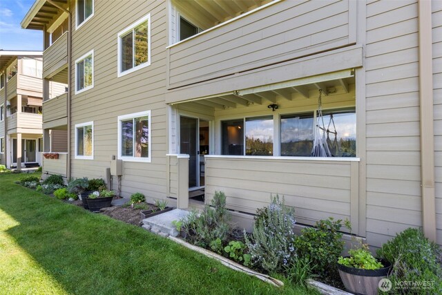 20145 Vikings Crest Loop NE Unit 3-105, Poulsbo, WA 98370 - view of side of home featuring a yard