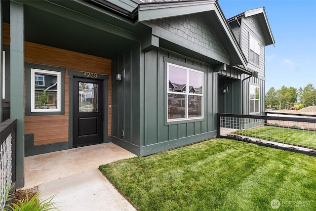 4230 Melrose Ln, Bellingham, WA 98226 - entrance to property featuring board and batten siding, a yard, and covered porch