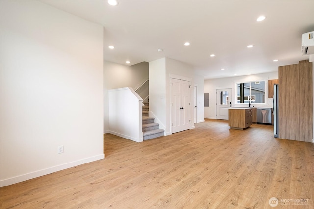 4230 Melrose Ln, Bellingham, WA 98226 - unfurnished living room with stairs, recessed lighting, and light wood-type flooring