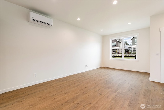 4230 Melrose Ln, Bellingham, WA 98226 - spare room featuring a wall mounted AC, light wood-type flooring, and recessed lighting