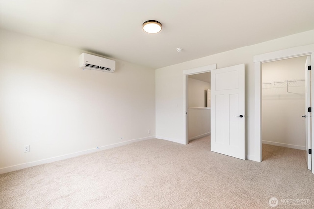 4230 Melrose Ln, Bellingham, WA 98226 - unfurnished bedroom with a wall mounted air conditioner, light carpet, a spacious closet, and a closet