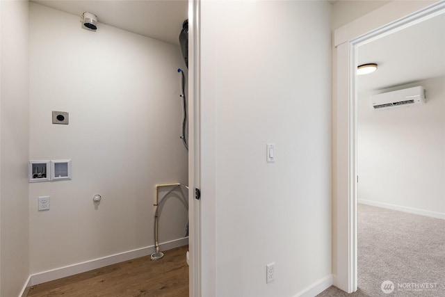 4230 Melrose Ln, Bellingham, WA 98226 - washroom with a wall unit AC, gas dryer hookup, hookup for a washing machine, electric dryer hookup, and wood finished floors